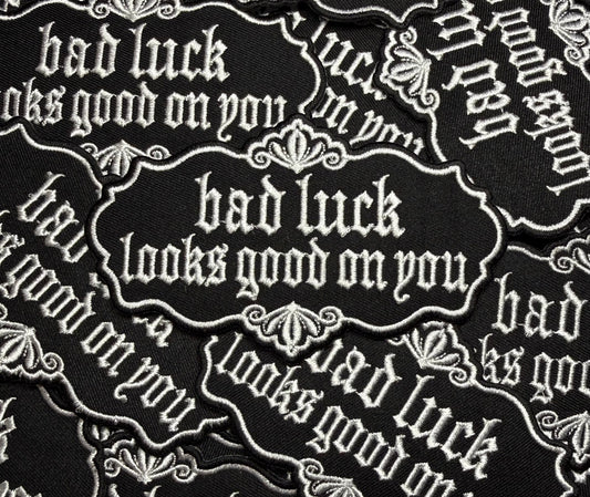 BAD LUCK LOOKS GOOD ON YOU